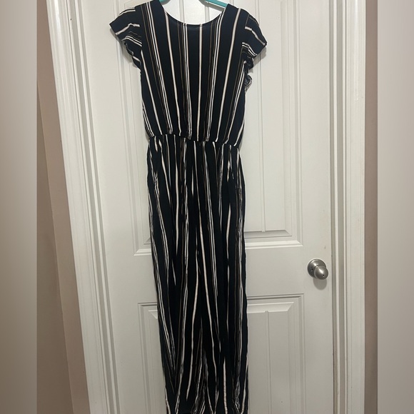 This is a romper. Gold,Black,and White. Used condition. - Picture 2 of 2